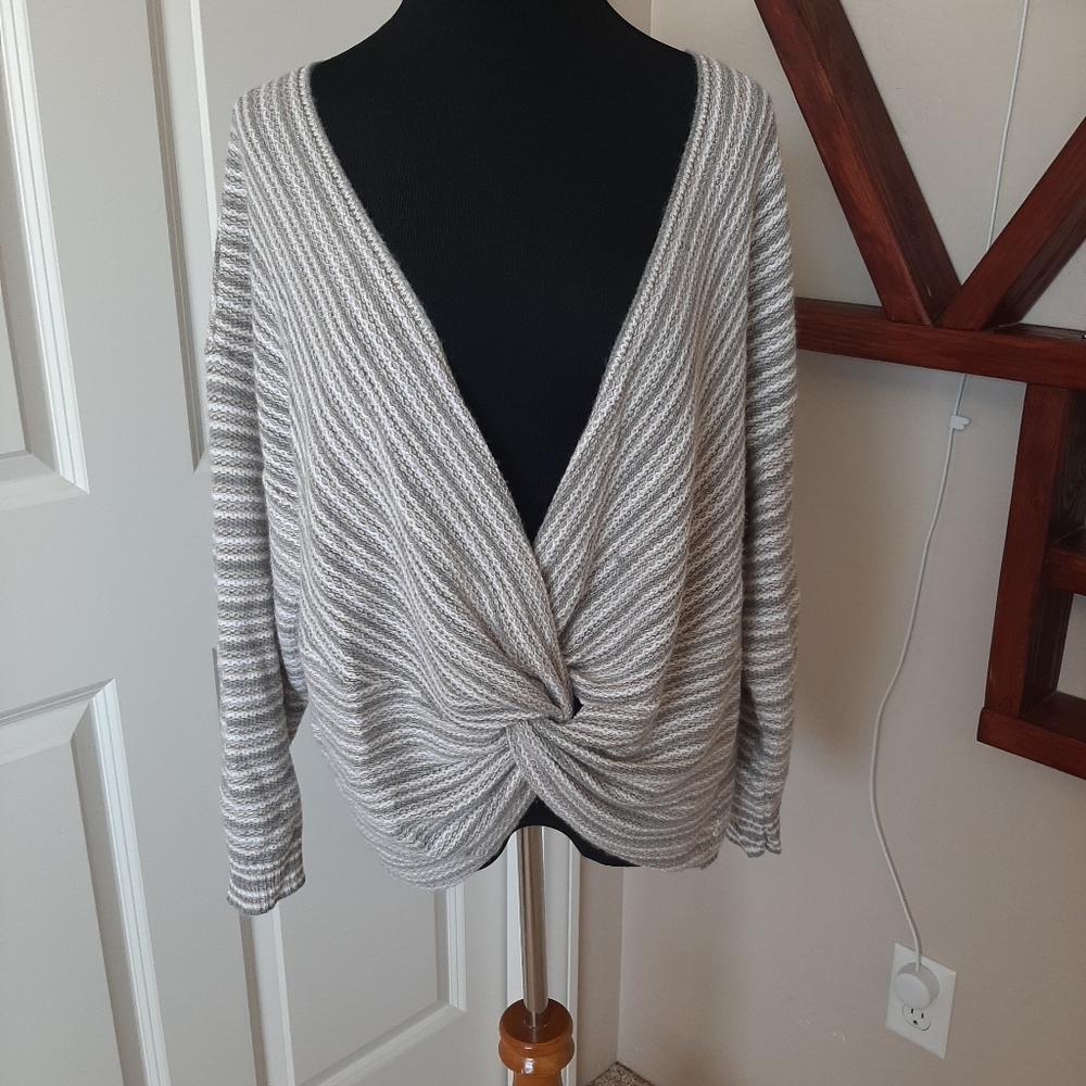 Twist front v neck sweater.